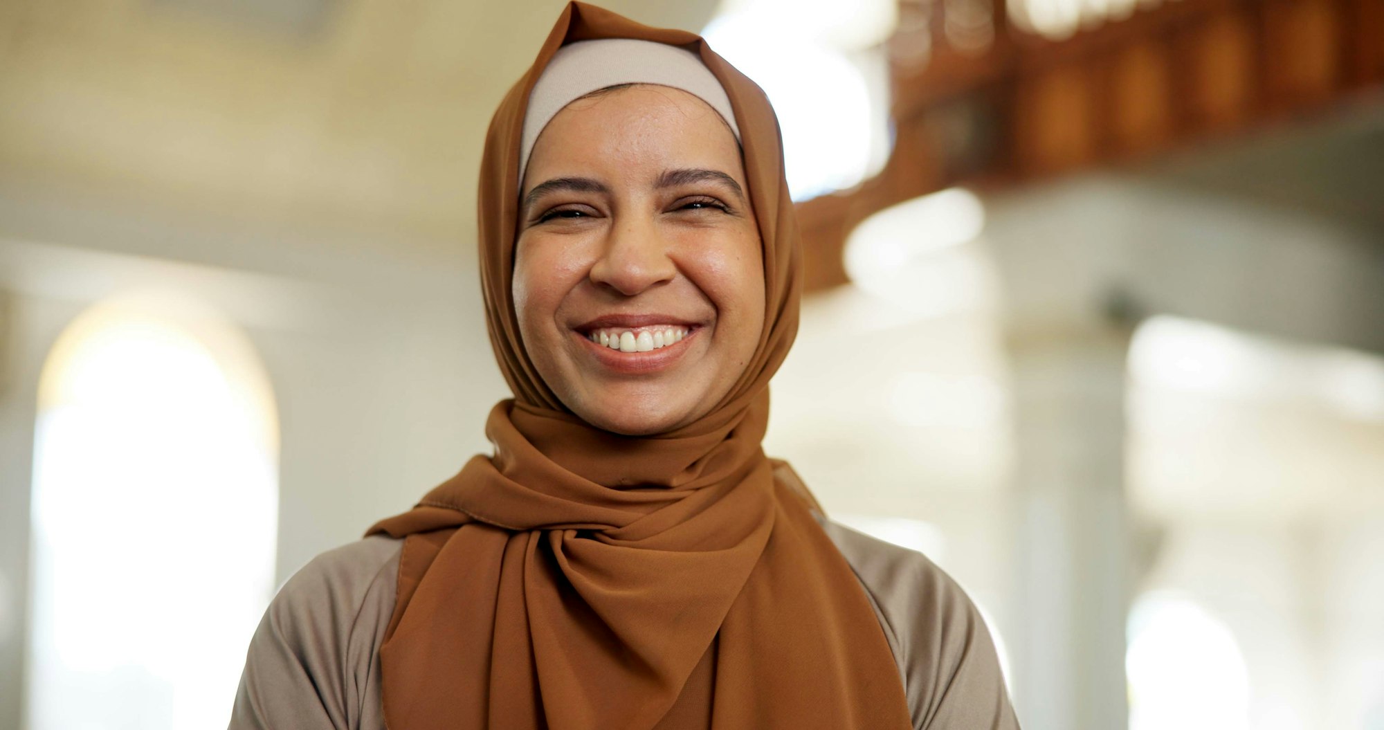 Faith, muslim and portrait of woman in mosque for praying, worship and islam religion. Eid Mubarak,