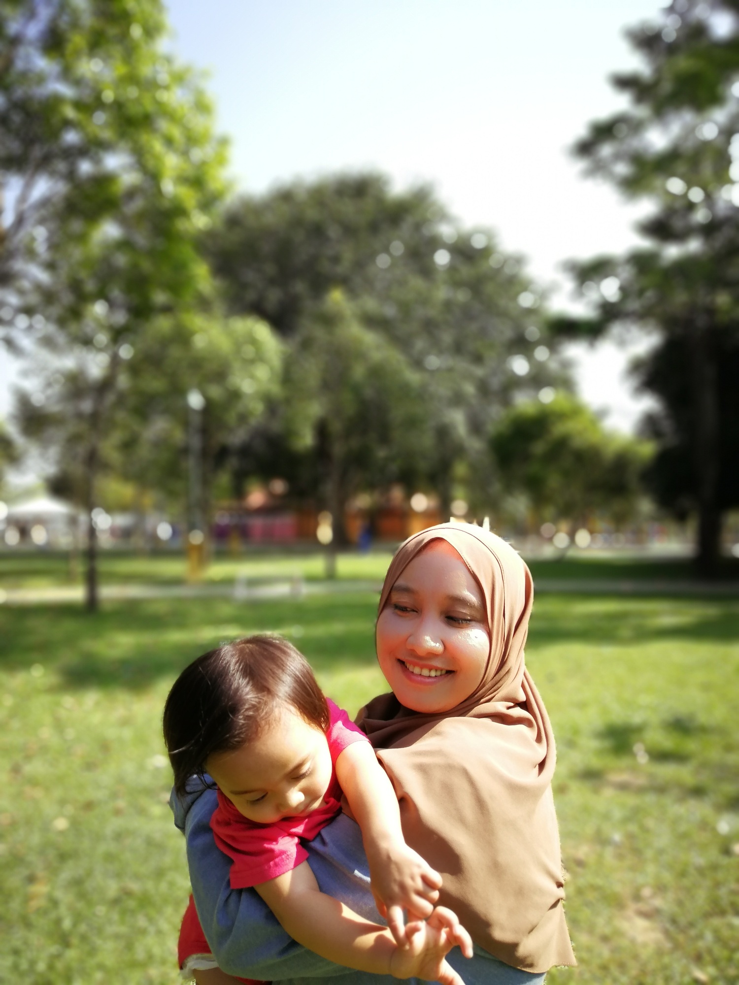 Baby and mother in hijab in the park. Baby and mother in hijab in the park.